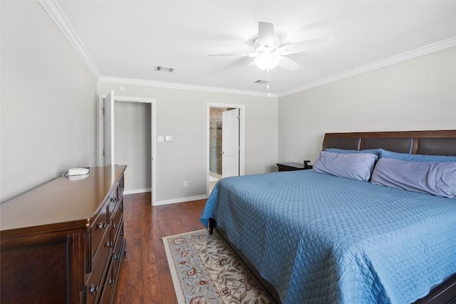 bedroom with connected bathroom, ornamental molding, dark hardwood / wood-style floors, and ceiling fan