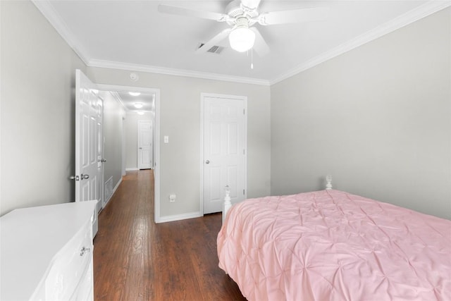 bedroom with dark hardwood / wood-style flooring, ornamental molding, and ceiling fan