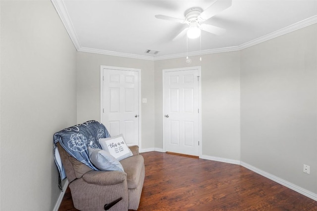 living area with dark hardwood / wood-style flooring, crown molding, and ceiling fan