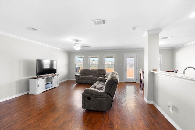 living room featuring crown molding, ceiling fan, and dark hardwood / wood-style flooring