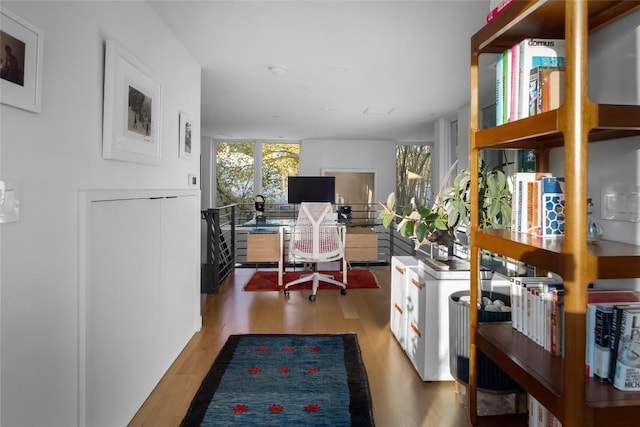 office with light wood-type flooring