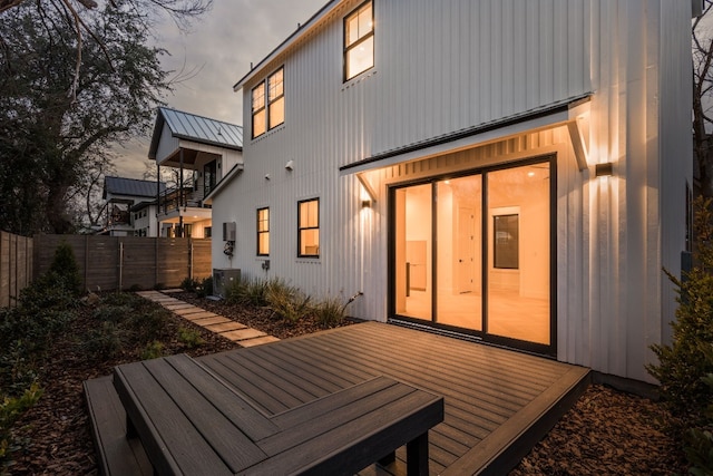 rear view of house featuring a deck