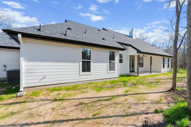 rear view of property with central AC unit and a patio area