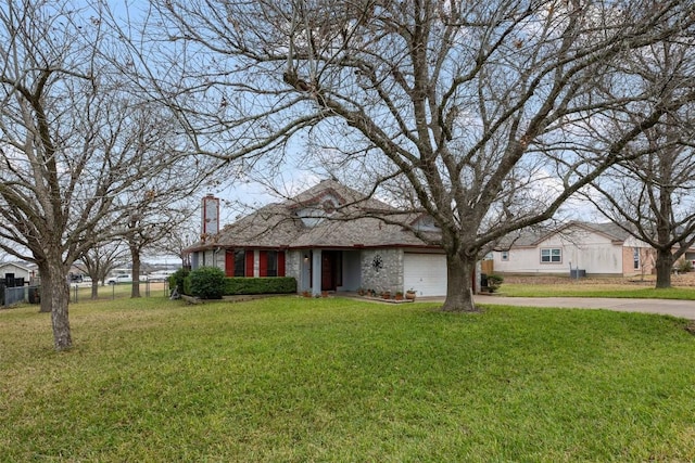 ranch-style home with a garage and a front yard