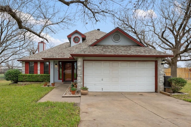 view of front of home featuring a garage and a front lawn