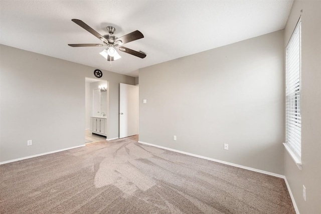 unfurnished room with light carpet and ceiling fan