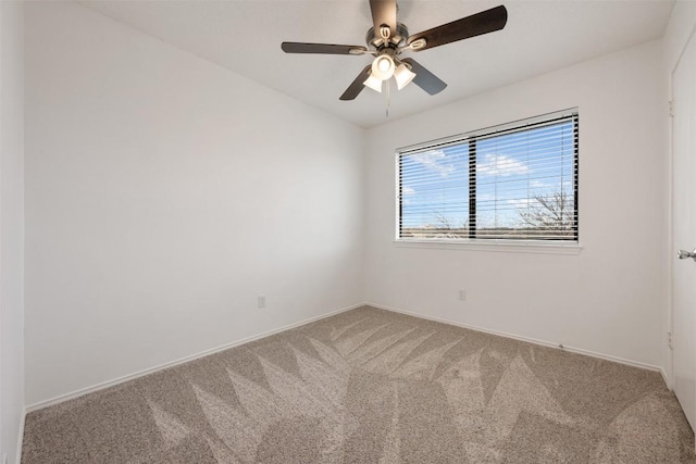 spare room with ceiling fan and carpet floors