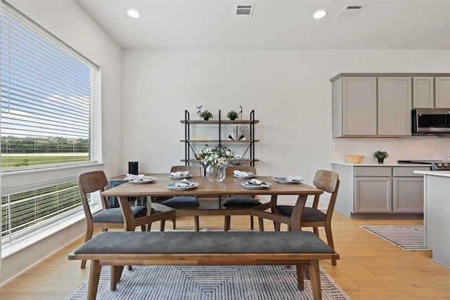 dining area featuring light wood-type flooring