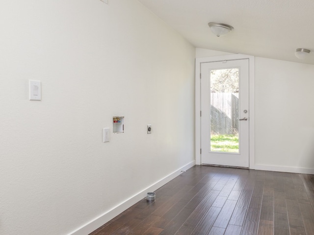 entryway with lofted ceiling and dark wood-type flooring