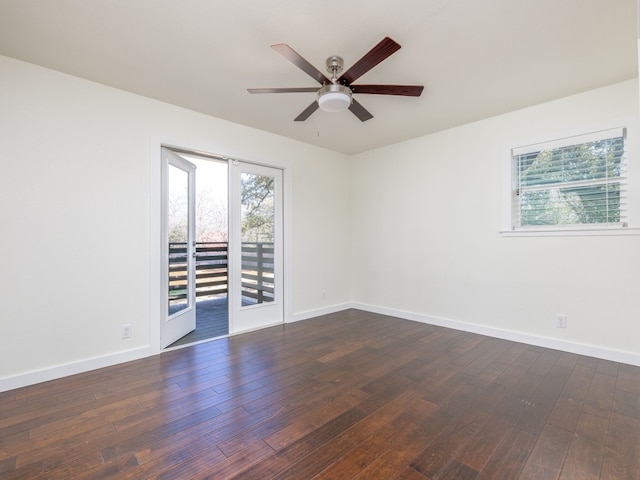 unfurnished room featuring dark wood-type flooring and ceiling fan