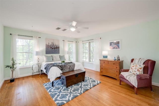 bedroom with wood-type flooring and ceiling fan