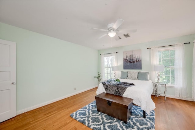 bedroom featuring hardwood / wood-style floors and ceiling fan