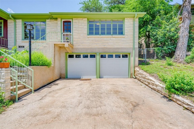 view of front of property with a garage