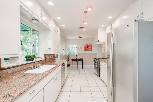 kitchen featuring pendant lighting, white cabinetry, stainless steel appliances, and sink