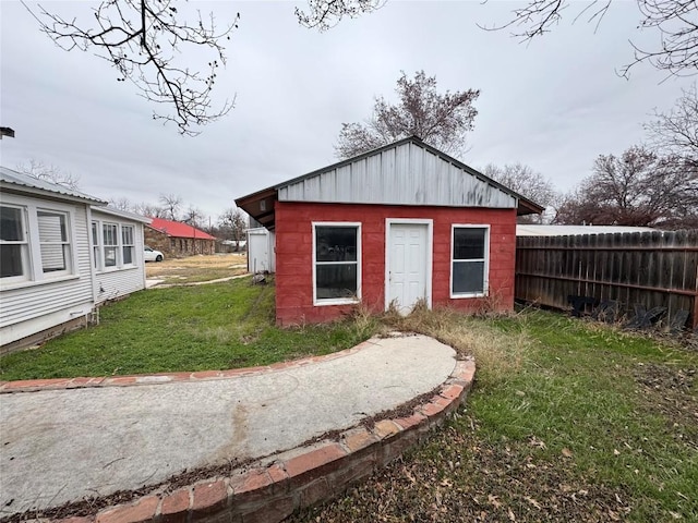 view of outdoor structure featuring a lawn