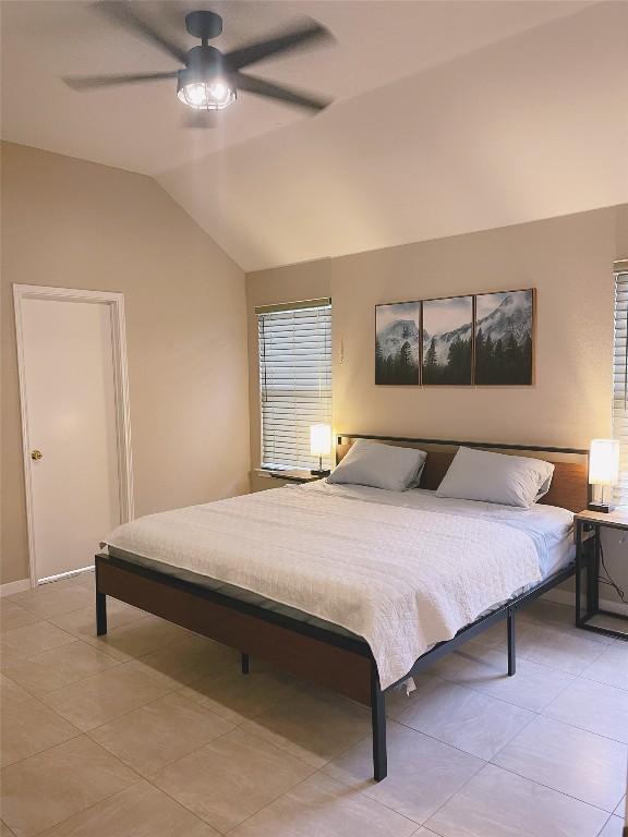 bedroom with vaulted ceiling and ceiling fan