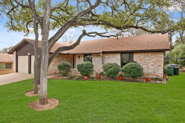 ranch-style home featuring a garage and a front lawn