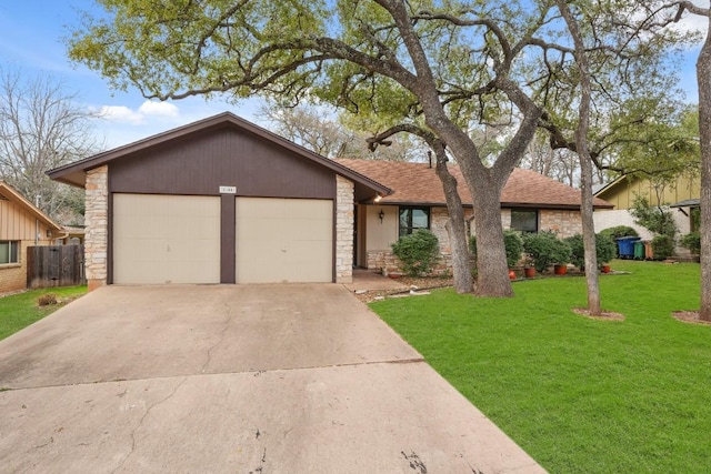 ranch-style home with a garage and a front yard