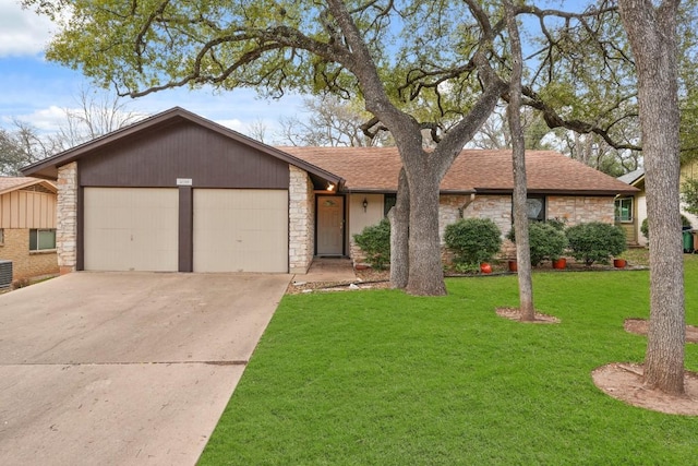 ranch-style home featuring a garage and a front yard