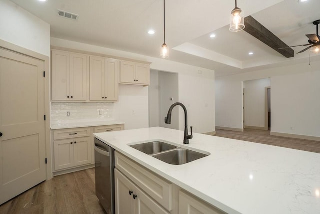 kitchen with decorative light fixtures, sink, decorative backsplash, hardwood / wood-style flooring, and stainless steel dishwasher