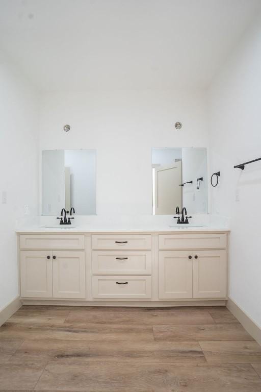 bathroom with vanity and hardwood / wood-style floors