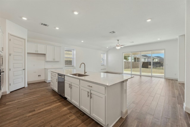 kitchen featuring white cabinetry, appliances with stainless steel finishes, a kitchen island with sink, and sink