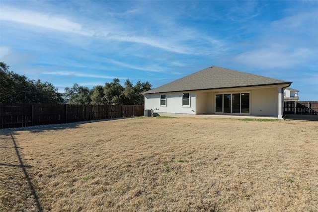 back of property featuring a yard and a patio area