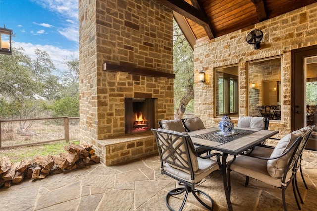 view of patio / terrace featuring an outdoor stone fireplace