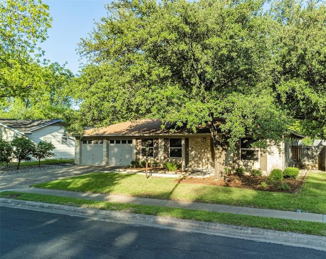 view of front facade with a garage and a front lawn