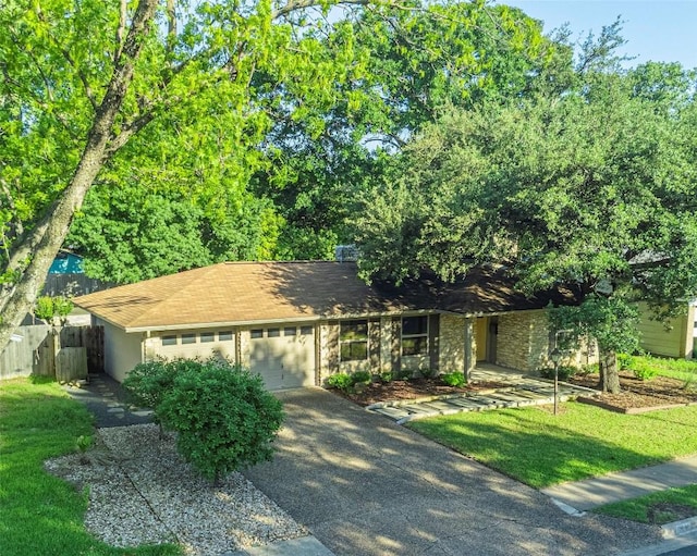 ranch-style home featuring a garage