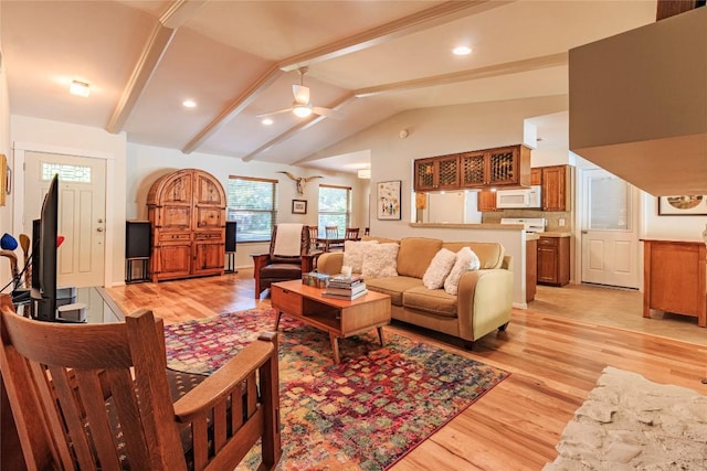 living room with beamed ceiling, ceiling fan, high vaulted ceiling, and light wood-type flooring