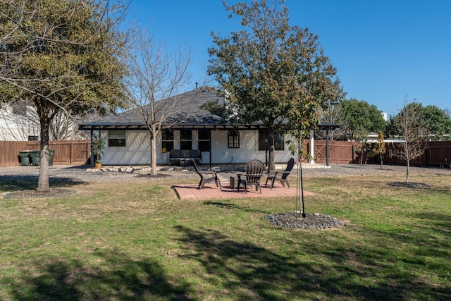 back of house featuring a yard and a patio area