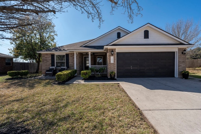 single story home with a garage, covered porch, and a front lawn