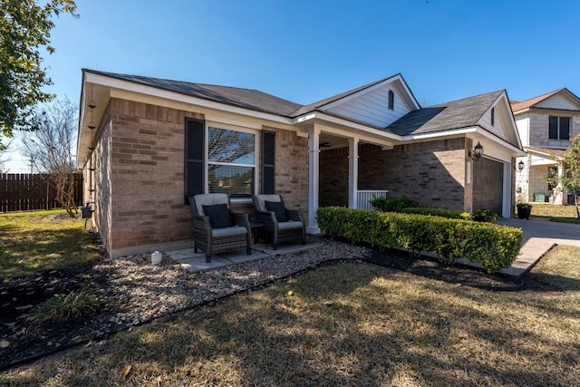 ranch-style home with a garage and a front yard