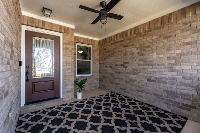 entrance to property with ceiling fan