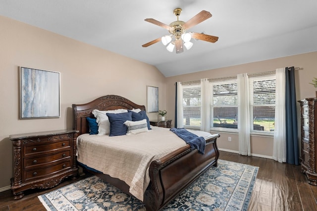 bedroom featuring ceiling fan, lofted ceiling, and dark hardwood / wood-style flooring