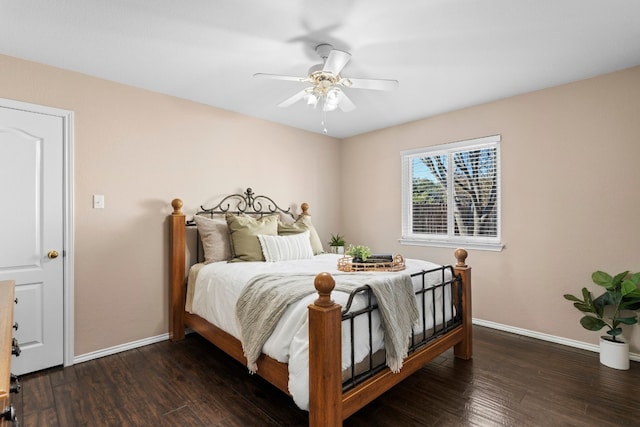 bedroom featuring dark hardwood / wood-style floors and ceiling fan