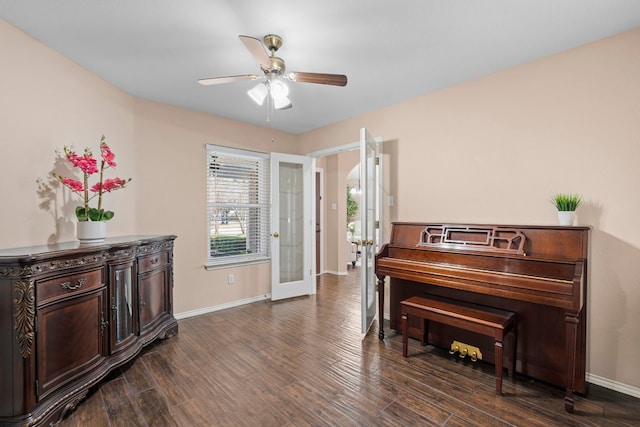 miscellaneous room with dark hardwood / wood-style floors, ceiling fan, and french doors