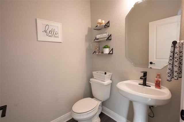 bathroom featuring toilet