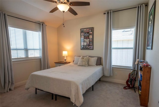 carpeted bedroom with lofted ceiling and ceiling fan