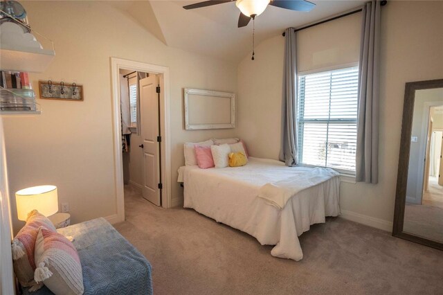 carpeted bedroom featuring lofted ceiling and ceiling fan