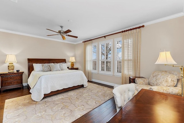 bedroom featuring crown molding, hardwood / wood-style flooring, and ceiling fan