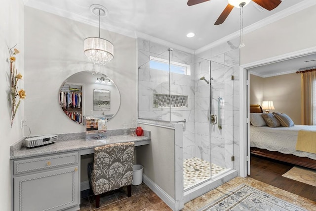 bathroom featuring hardwood / wood-style floors, a shower with door, ornamental molding, and ceiling fan