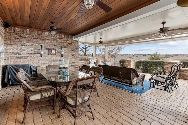 view of patio / terrace with area for grilling, an outdoor living space, and ceiling fan