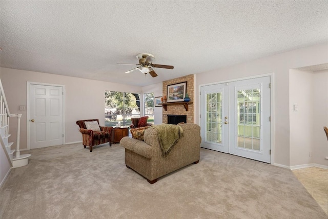 living room featuring light carpet, french doors, and a textured ceiling