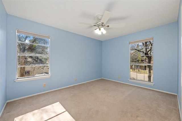 unfurnished room with light carpet and ceiling fan