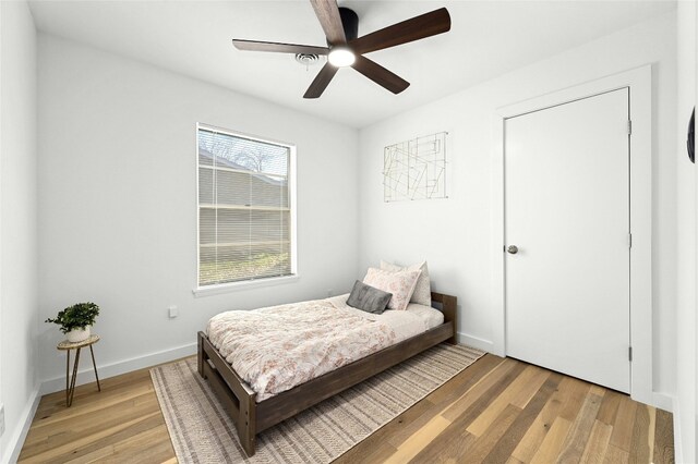 1801 Duke Ave, Austin, TX 78757 - bedroom featuring light wood-type flooring, baseboards, and ceiling fan