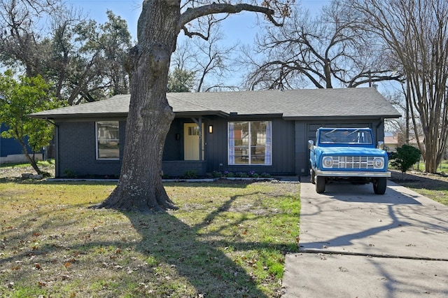 1801 Duke Ave, Austin, TX 78757 - ranch-style house with driveway, a front yard, and a shingled roof