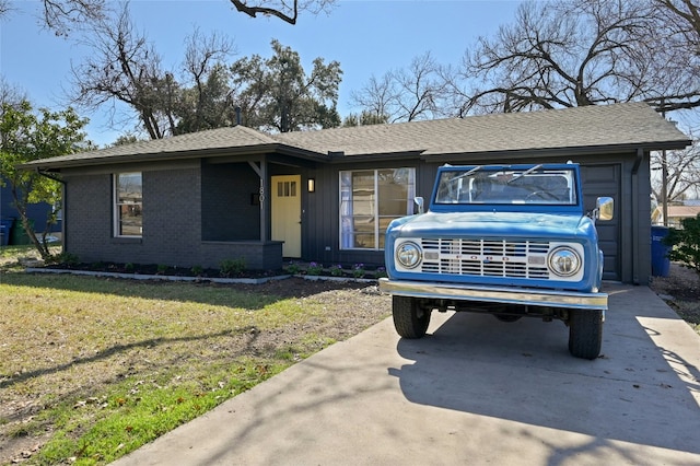 1801 Duke Ave, Austin, TX 78757 - ranch-style house with a front lawn, driveway, and a shingled roof