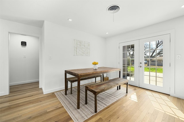 1801 Duke Ave, Austin, TX 78757 - dining room with light wood-style floors, recessed lighting, baseboards, and french doors